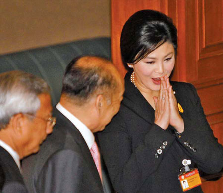 Embattled Yingluck survives poll