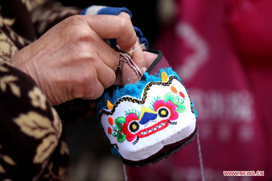 Handmade tiger-head shoes popular in China's new year