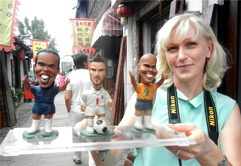 Artist creates dough figurine football stars