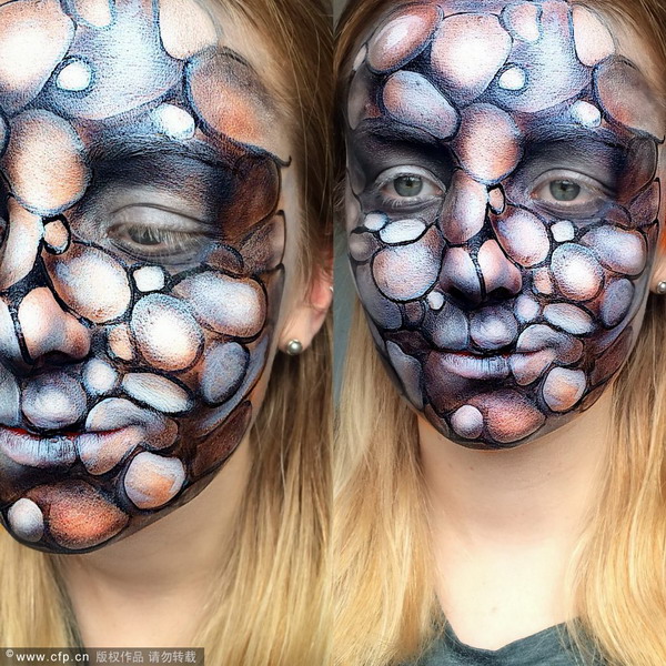 Make-up artist creates special-effects on her face