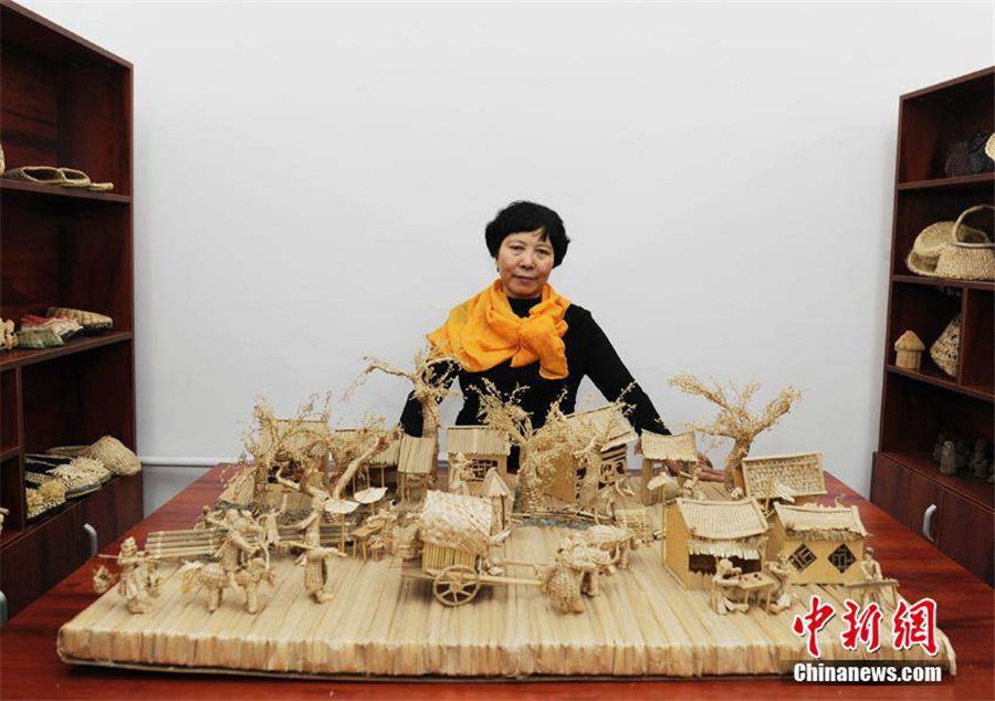 Straw artwork portrays ancient painting scenes
