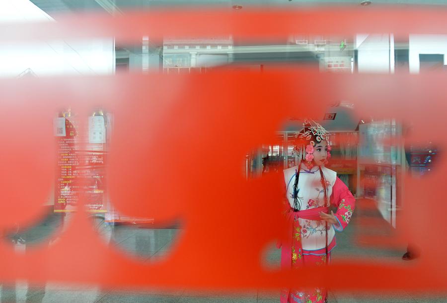 Children perform traditional Chinese Peking Opera