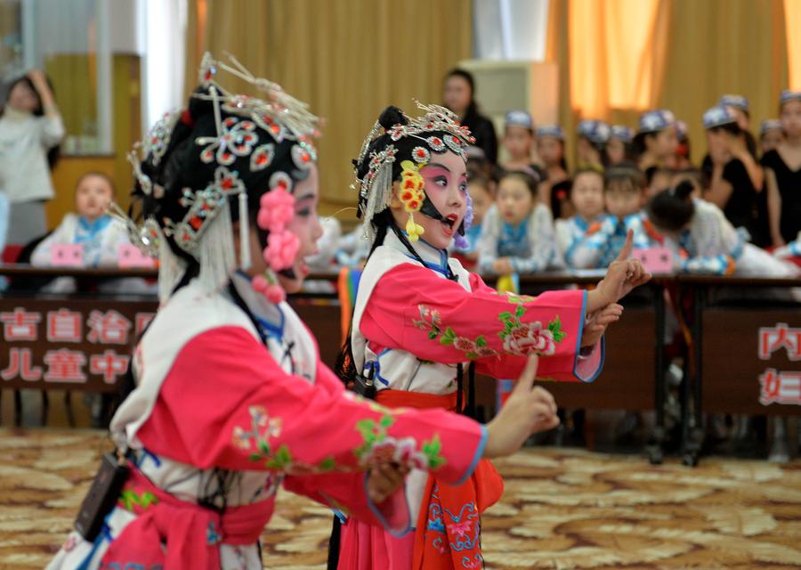 Children perform traditional Chinese Peking Opera