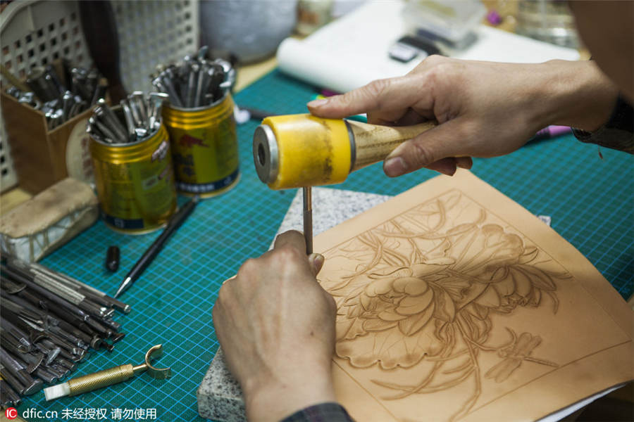 A leather engraver's meditative craft