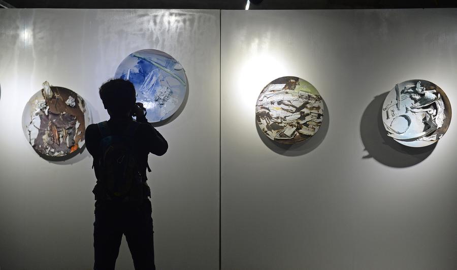 Visitors view ceramic craftworks in China Jingdezhen Int'l Ceramic Fair