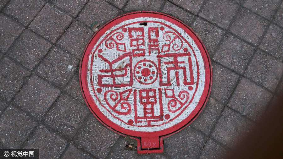 Students turn manhole covers into works of art