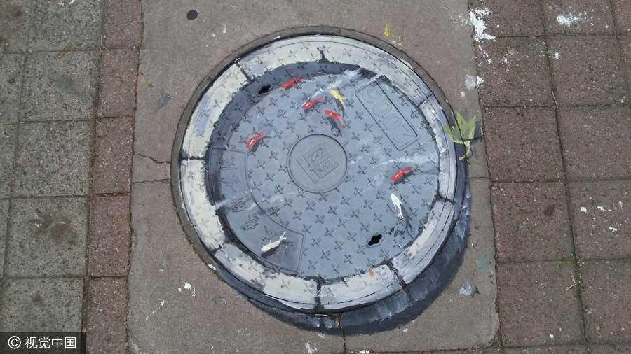 Students turn manhole covers into works of art