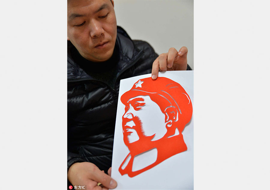 Guizhou folk artist keen to pass on paper cutting art