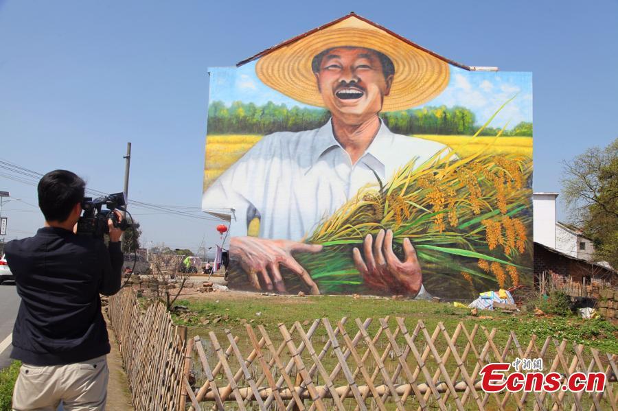Giant 3D paintings draw visitors to remote village