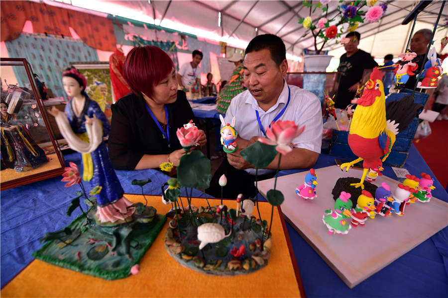 Dough figurines showcased at heritage expo in Shandong