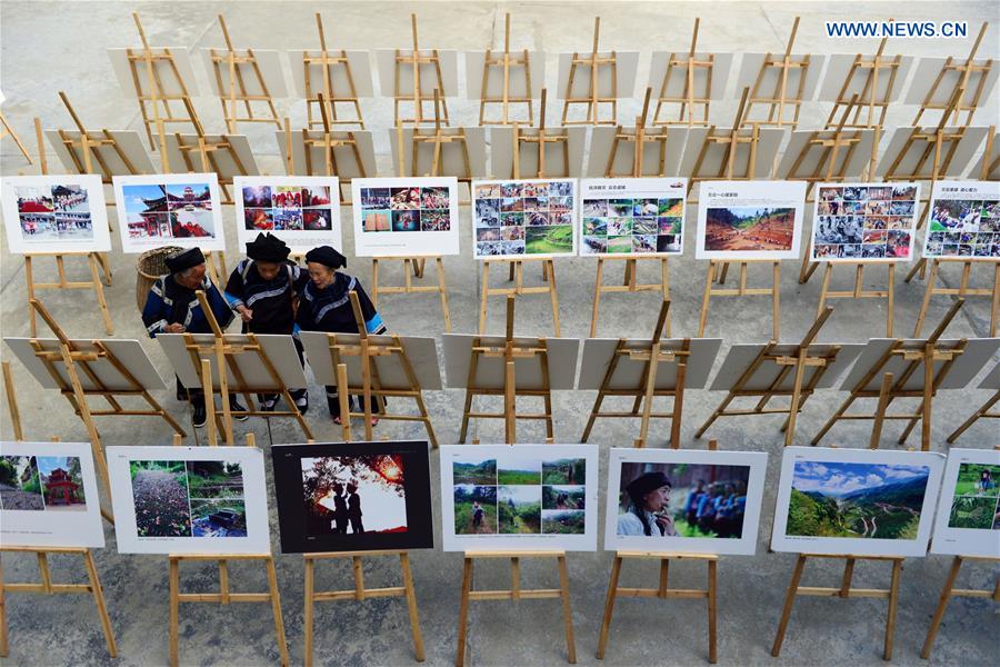 Photo exhibition on customs, life of villagers held in SW China