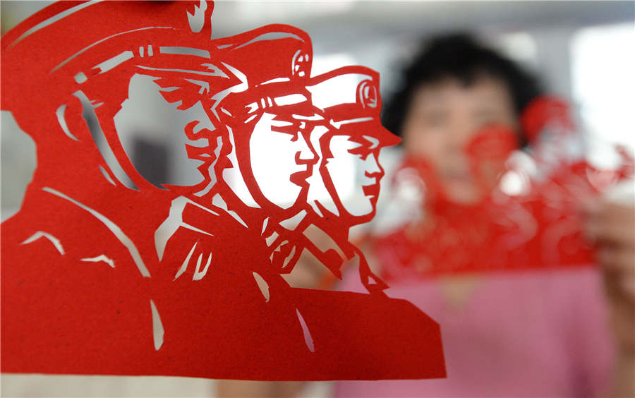 Artist creates paper-cuts to mark PLA's 90th anniversary