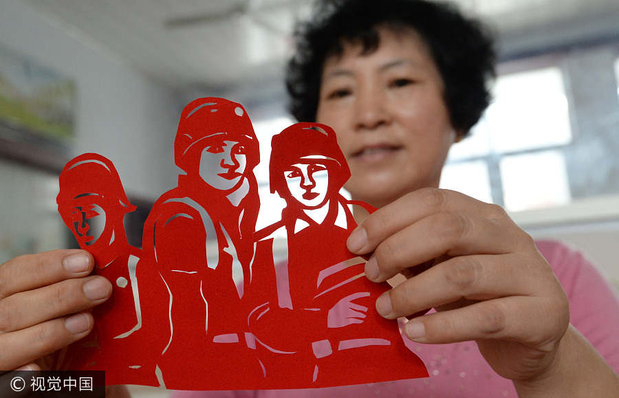 Artist creates paper-cuts to mark PLA's 90th anniversary