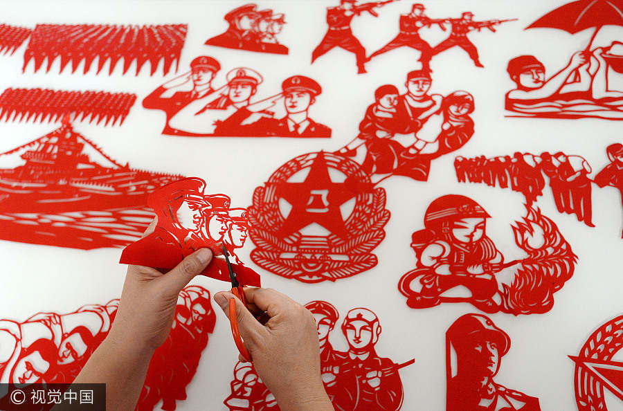 Artist creates paper-cuts to mark PLA's 90th anniversary