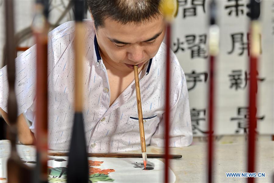 Man learns traditional Chinese art skills to change fate