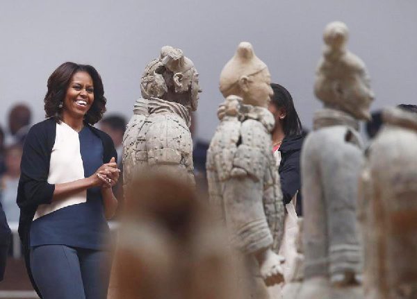 Obamas visit ancient guards, modern kids