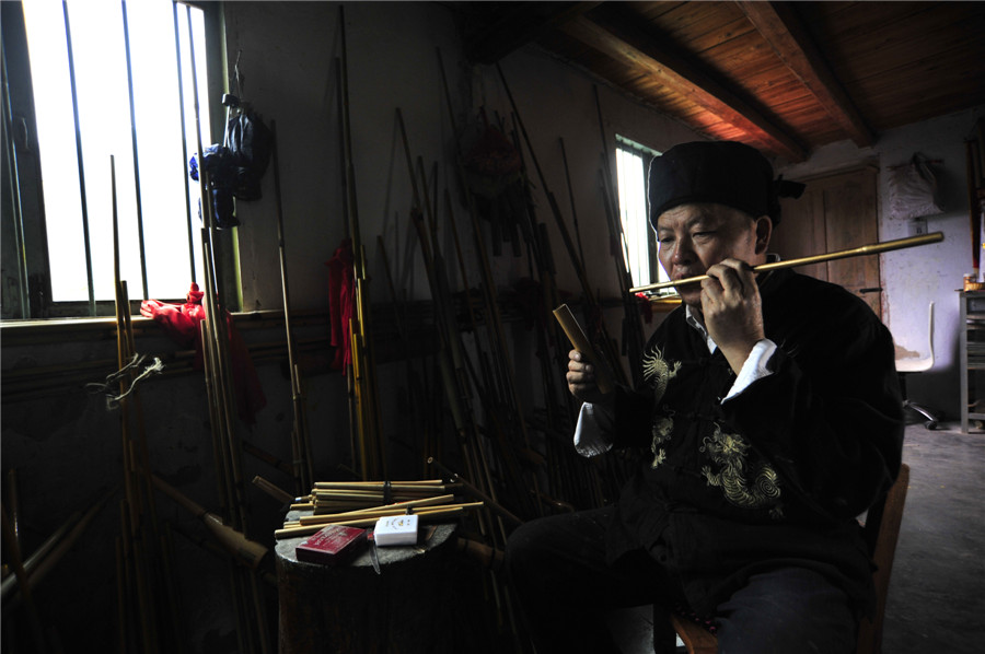 Inheritor of reed-pipe wind instrument 'Lusheng' in Guizhou