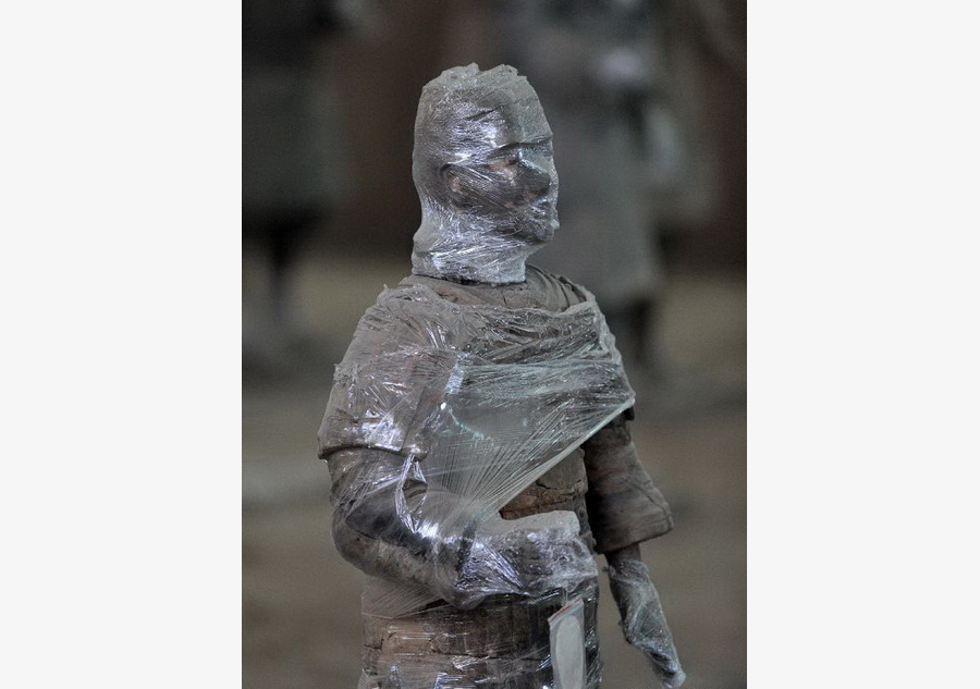 Terracotta warriors wrapped in cling film