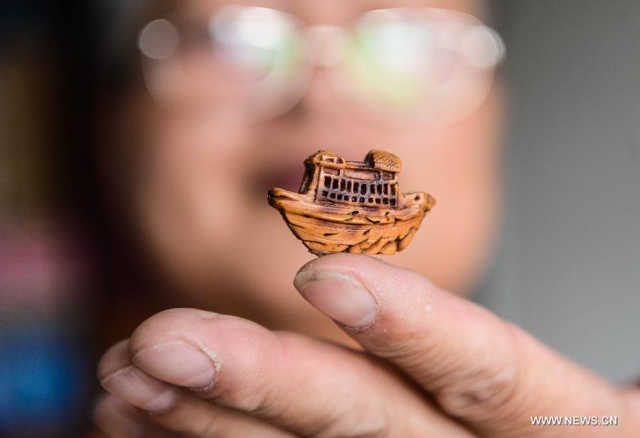 Peach pit carving: Chinese folk art on fingertips