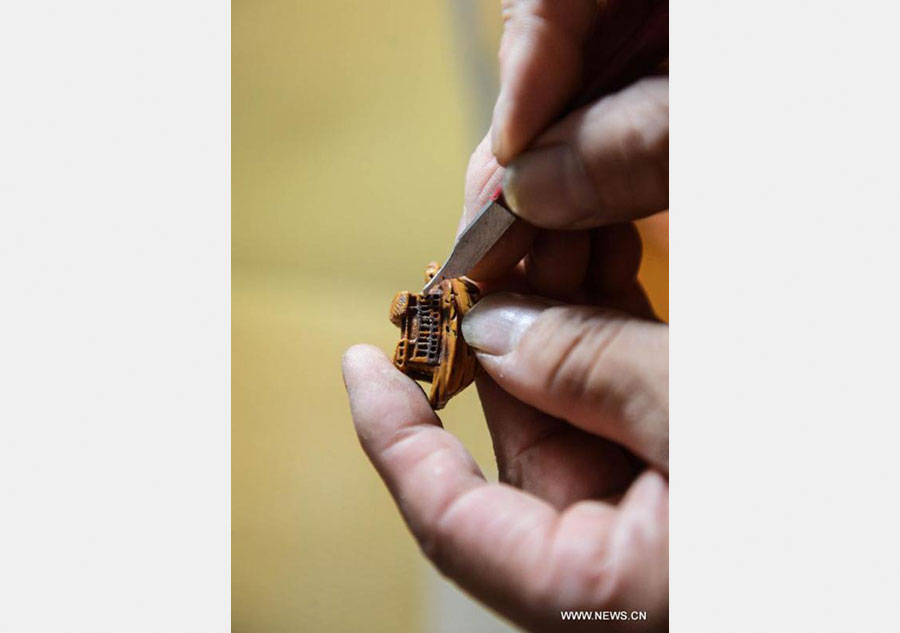 Peach pit carving: Chinese folk art on fingertips