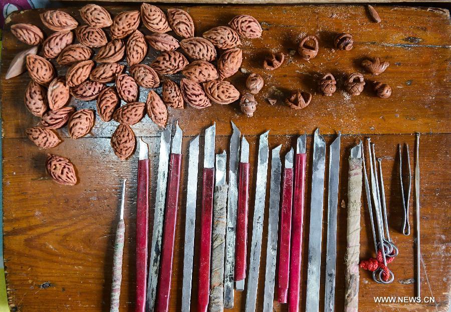 Peach pit carving: Chinese folk art on fingertips