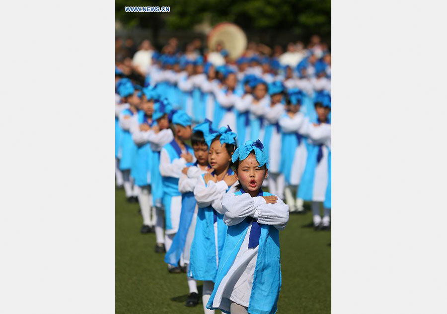 New first-graders attend traditional education activity in E China