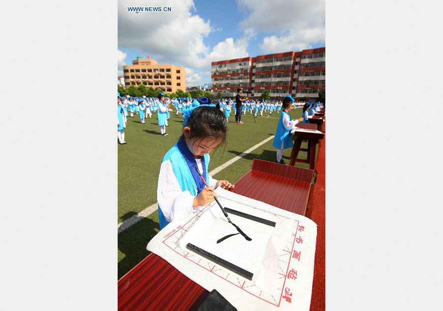 New first-graders attend traditional education activity in E China