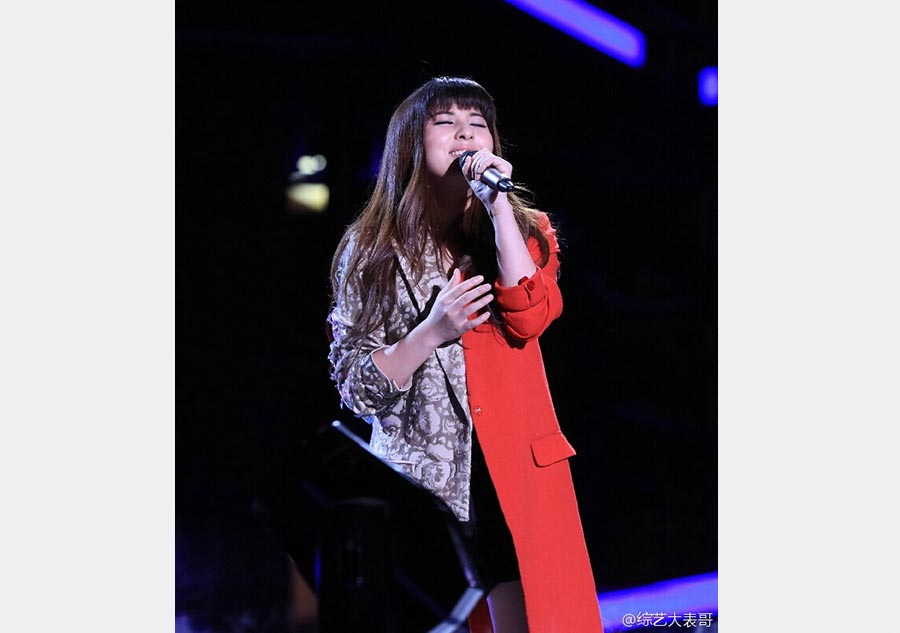 Zhang Lei wins fourth season of <EM>Voice of China</EM>