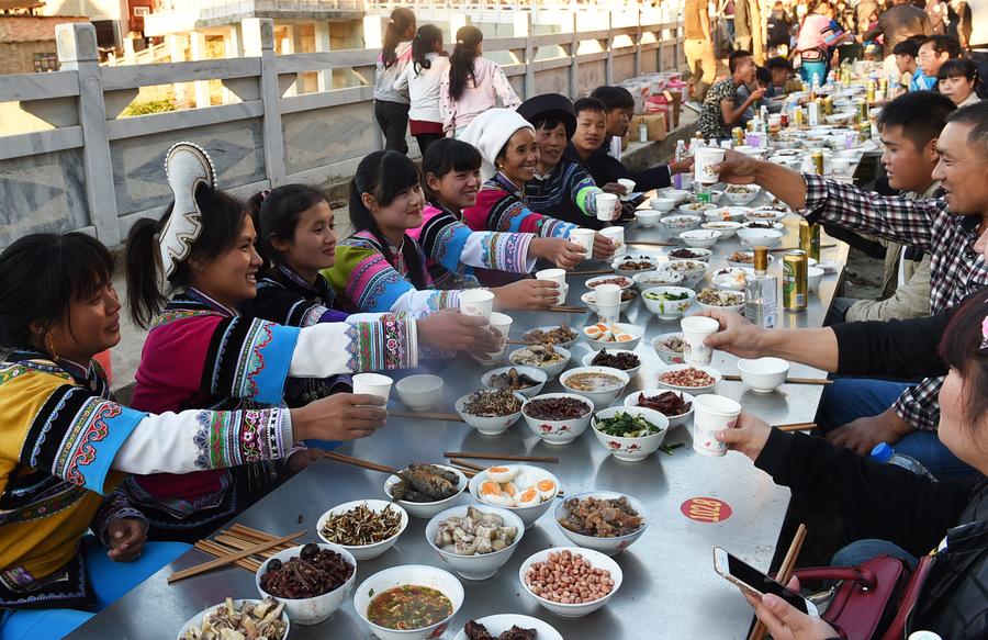 Locals enjoy themselves during traditional festival in Yunnan