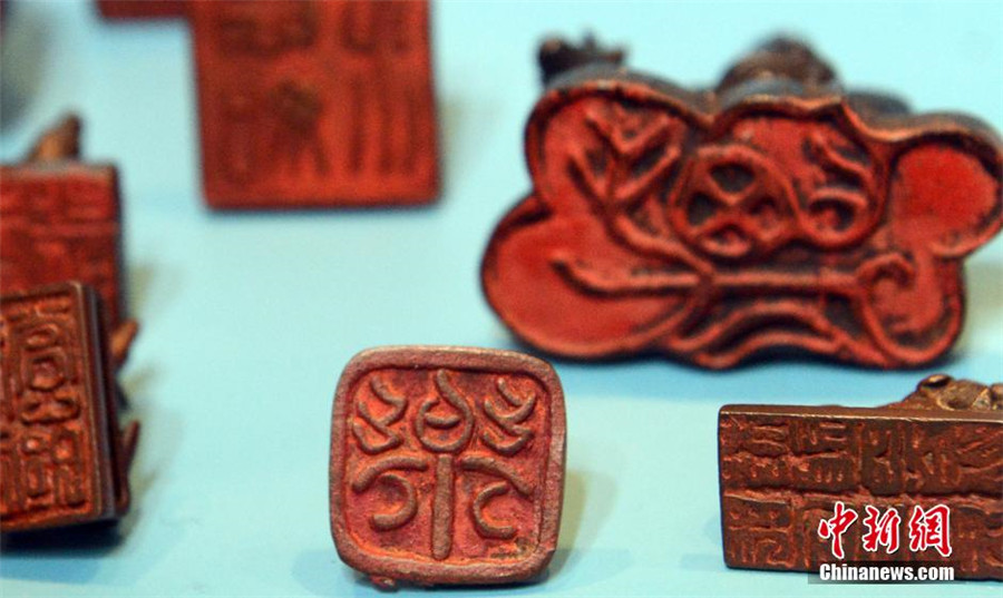 Copper Chinese Zodiac stamps shown in SE China