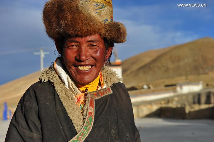 Villagers gather to dance 'Guozhuang' to celebrate Tibetan New Year