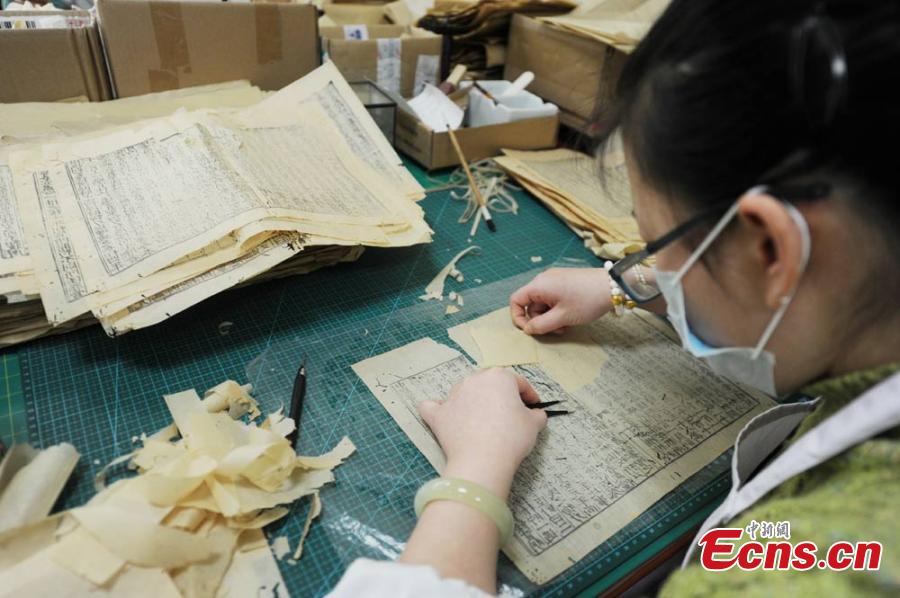 Great efforts needed to restore ancient books