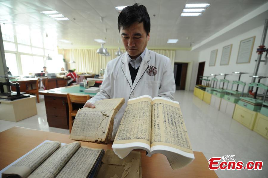 Great efforts needed to restore ancient books