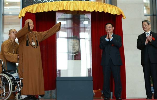 Ceremony held to unveil returned Buddha head in Beijing