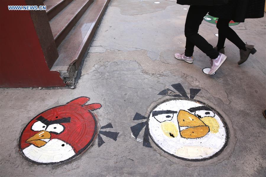 Cartoon figures painted on manhole covers in Shandong