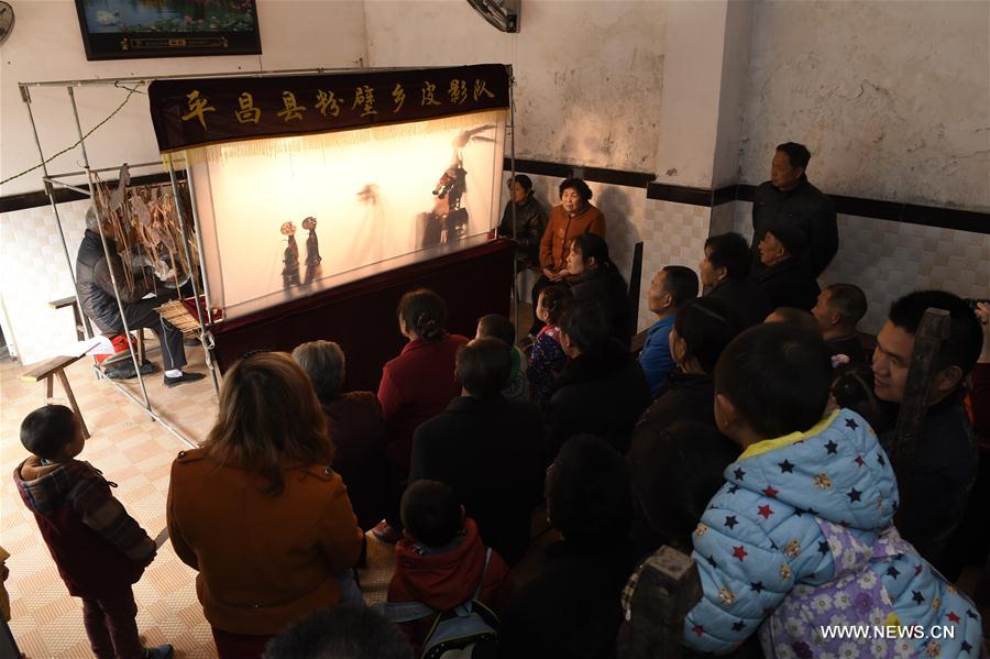 Folk artists perform shadow play in SW China