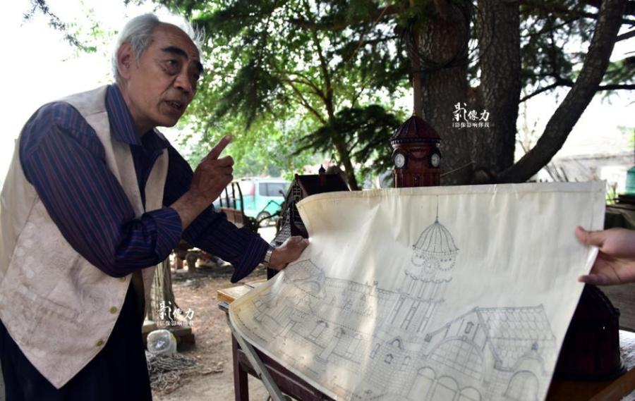 Retiree spends nearly three years carving iconic railway station