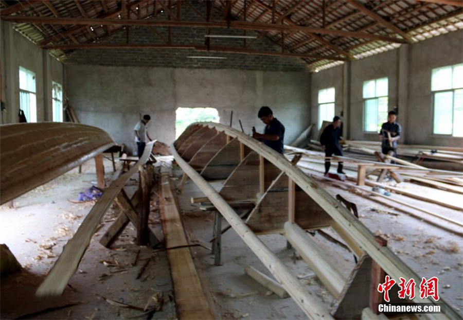 Craftsman busy making boats for Dragon Boat Festival