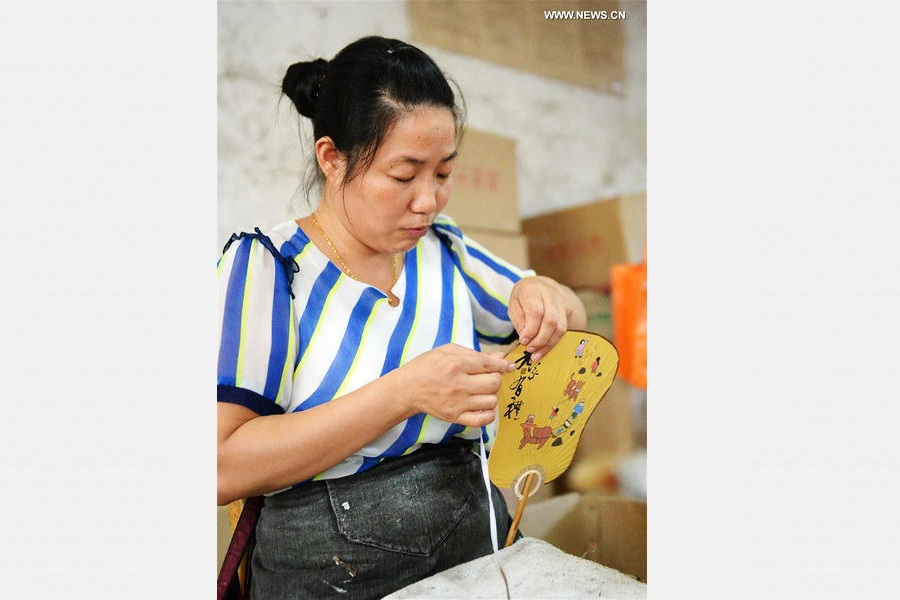 Traditional moon-shaped fan made in Guangxi