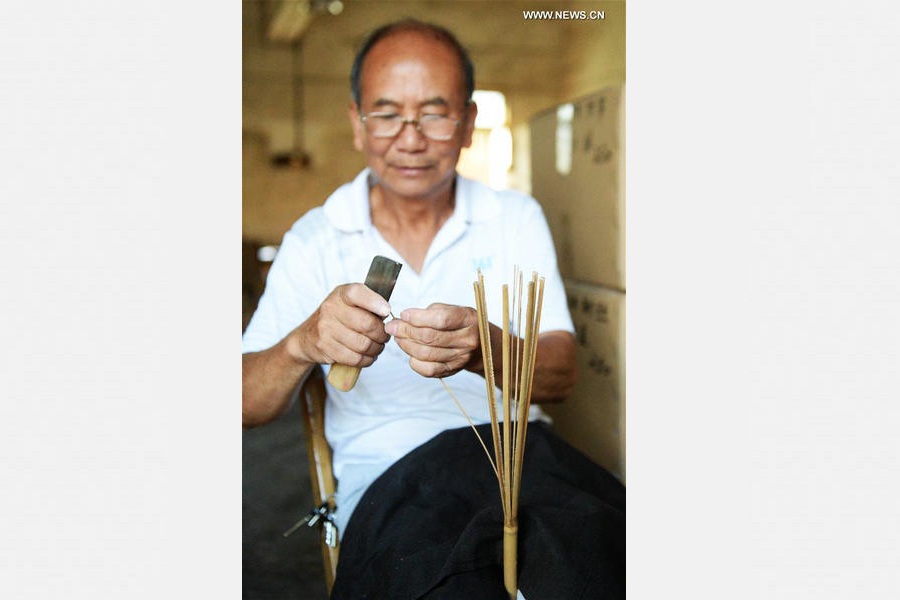 Traditional moon-shaped fan made in Guangxi