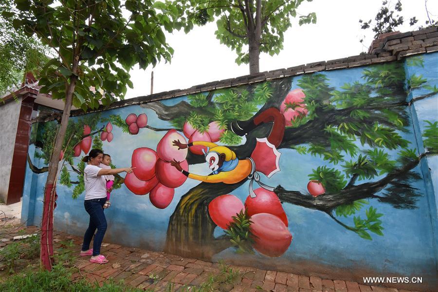 Qiannanbu village in N China covered with cultural graffiti works