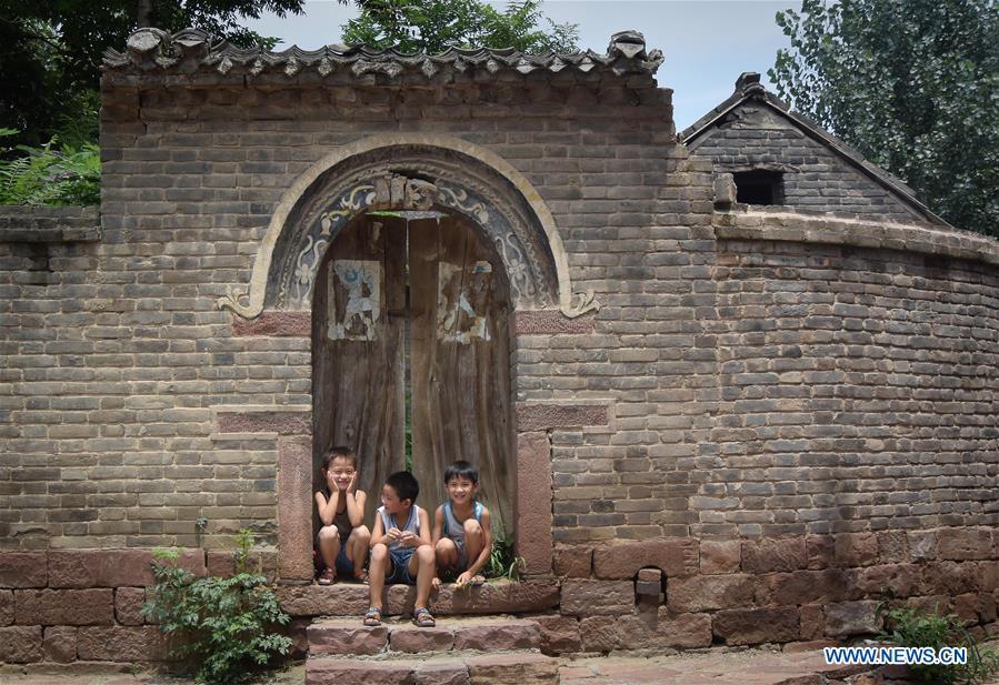 Linfeng village features complex built with red rocks in Henan