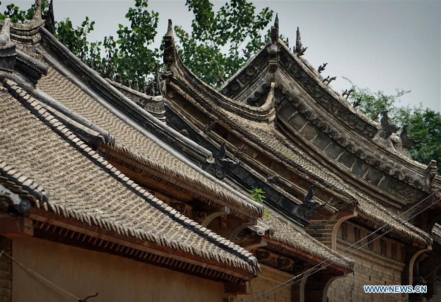 Linfeng village features complex built with red rocks in Henan