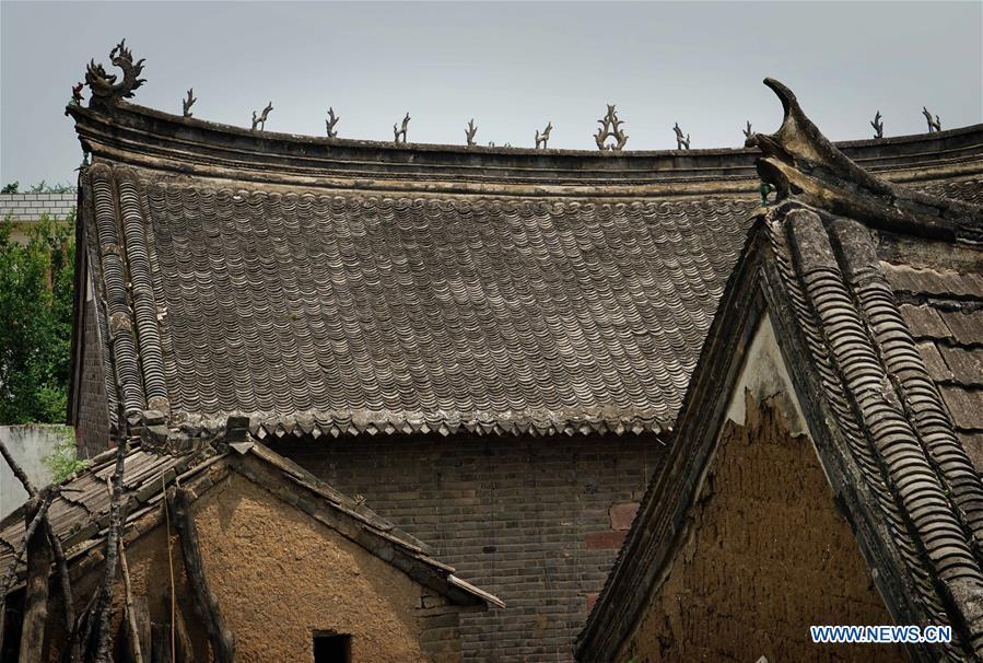 Linfeng village features complex built with red rocks in Henan