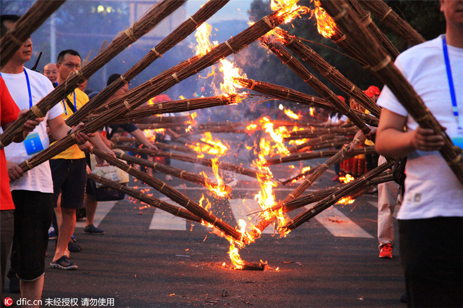 Yi ethnic people celebrate Torch Festival in Sichuan