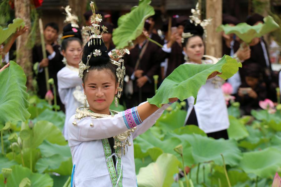 People of Dong ethnic group perform to promote local tourism