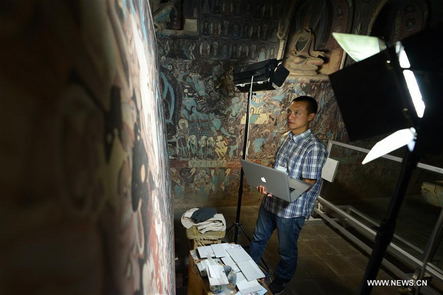 Films based on murals in cave of Mogao Grottoes completed