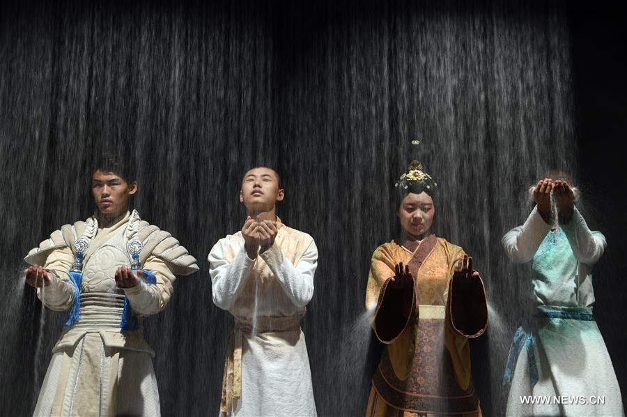 Actors perform during melodrama featuring silk road culture in Dunhuang