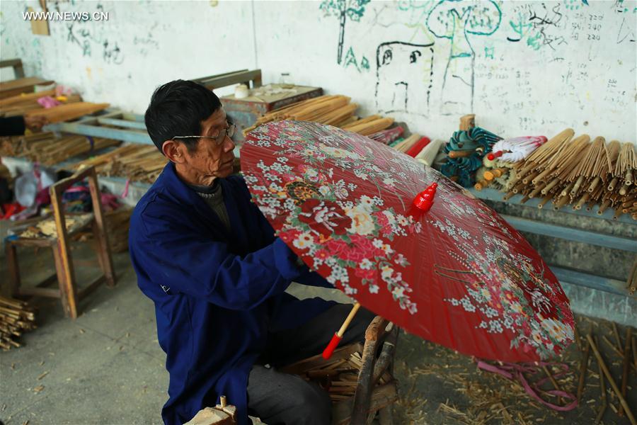 Traditional techniques of making Jialu oilpaper umbrellas in E China