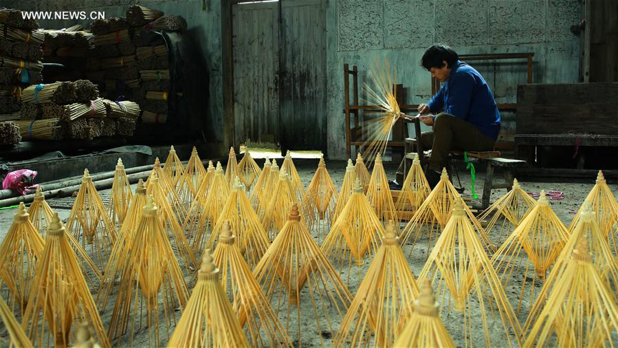 Traditional techniques of making Jialu oilpaper umbrellas in E China